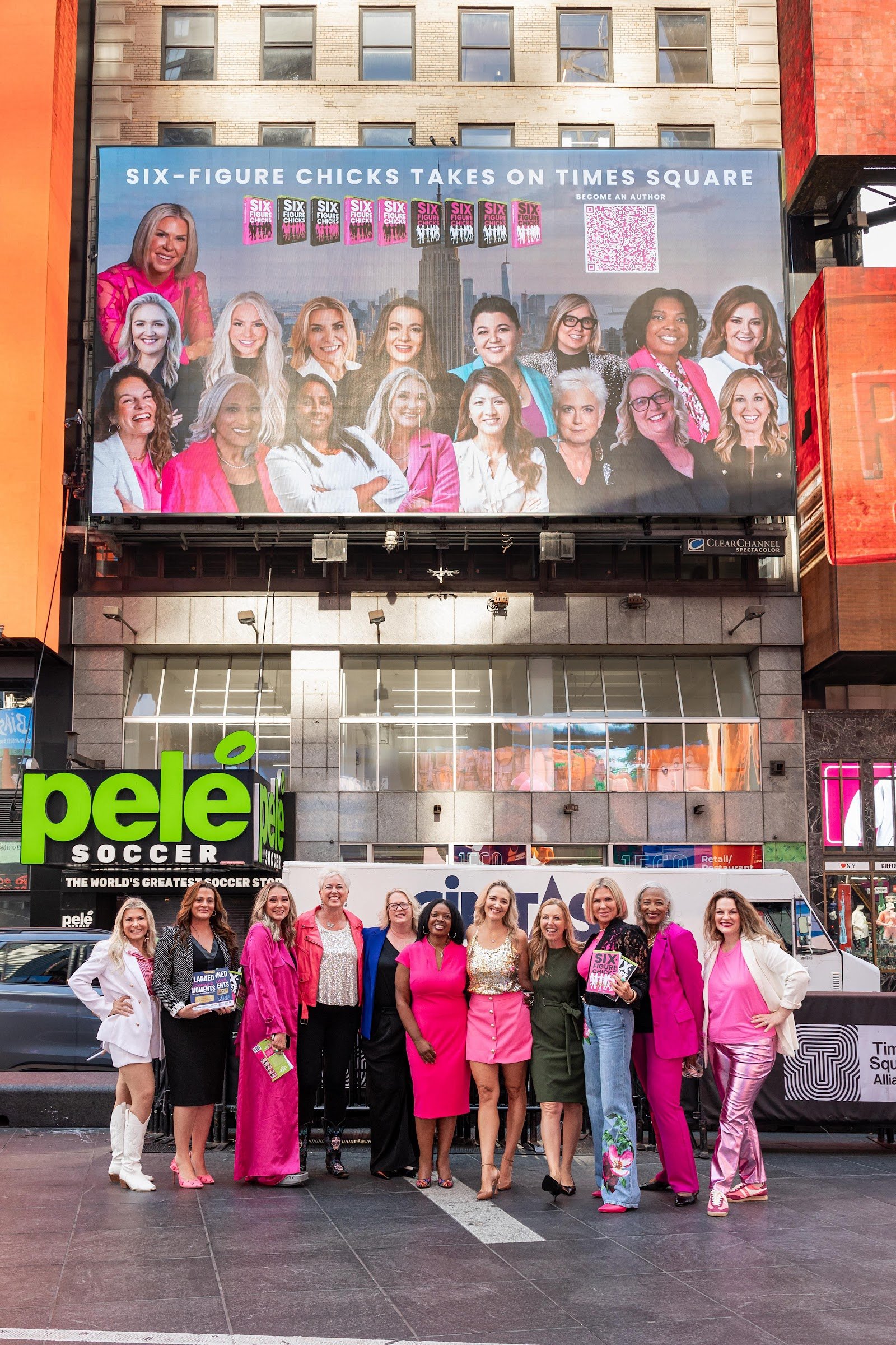 Six-Figure Chicks authors in front of their Times Square billboard