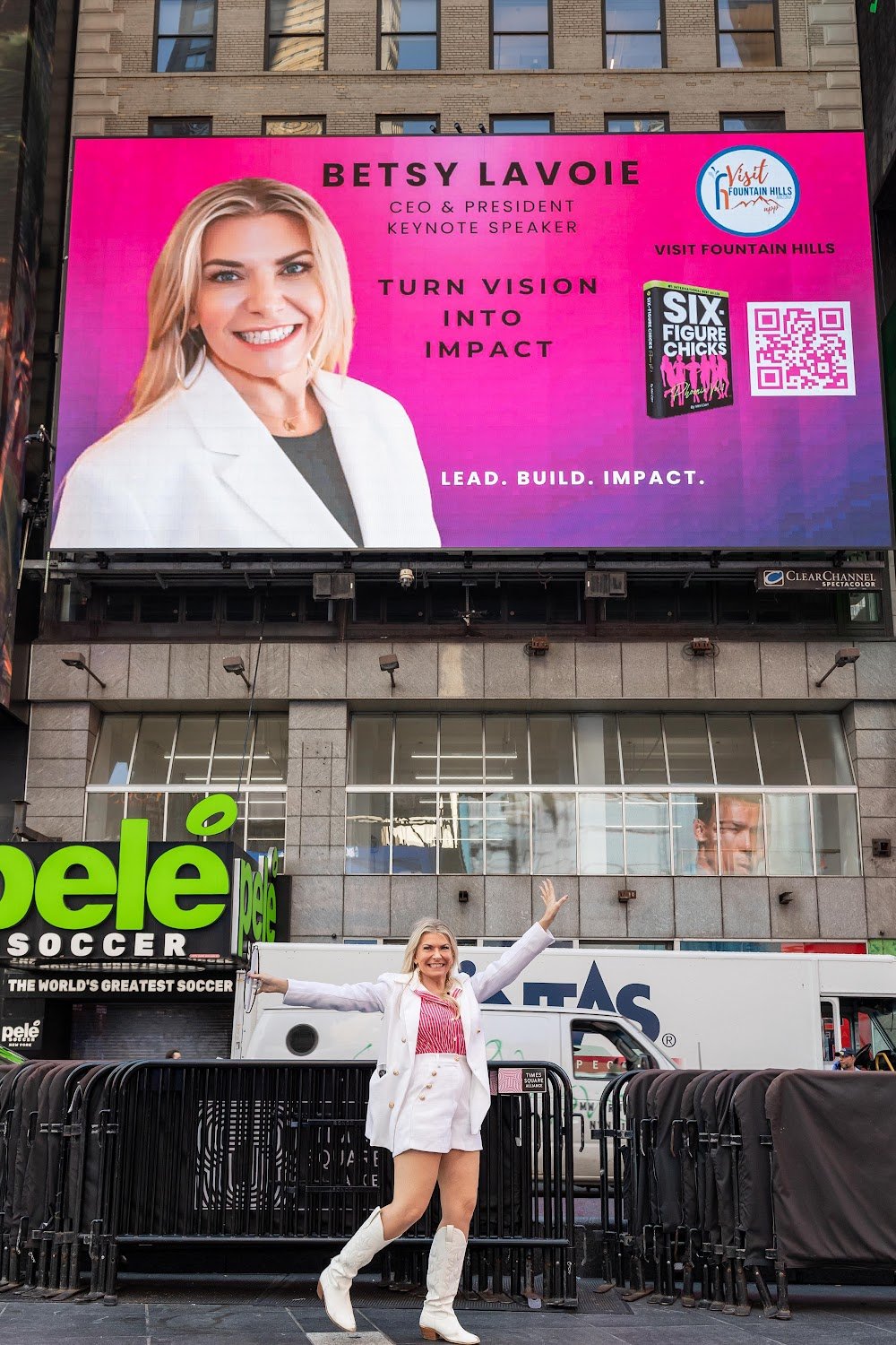 Six-Figure Chicks author celebrating under her Times Square billboard